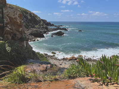Waterfall on Grotto beach (top).